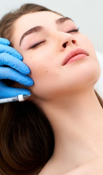 Jawline dermal filler treatment process with syringe