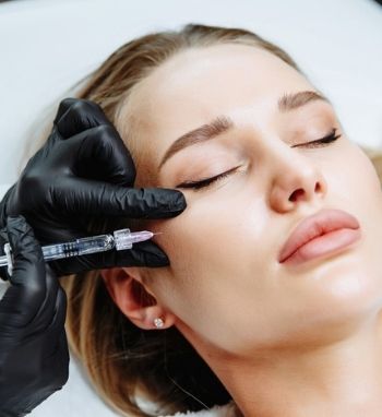 lady getting cheek enhancement with dermal fillers