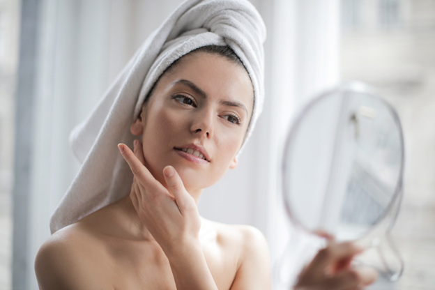 Attractive Lady admiring her healthy skin