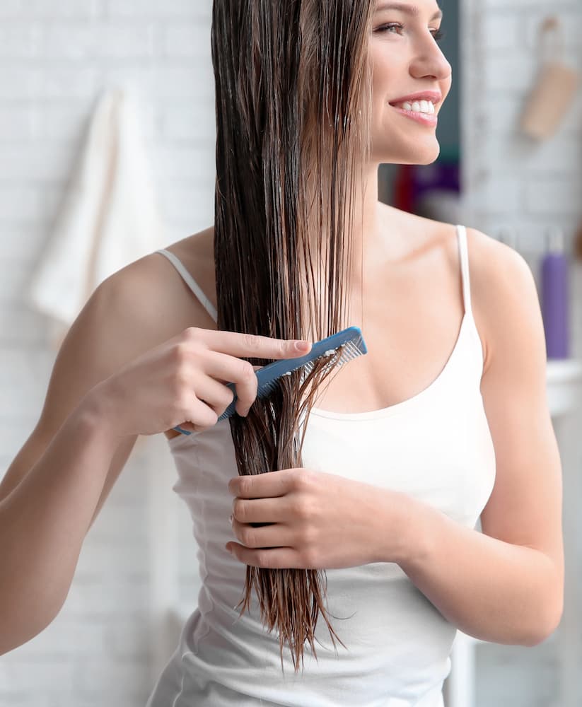 a woman bushing her hair